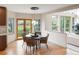 Bright breakfast nook with glass table and wicker chairs at 2512 Premier Pl, Boulder, CO 80304