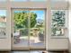 View of deck and backyard with mountain backdrop from interior at 2512 Premier Pl, Boulder, CO 80304