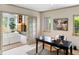 Bright home office with built-in shelving and access to living area at 2512 Premier Pl, Boulder, CO 80304