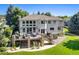 Luxury home with large deck, stone accents, and beautifully landscaped yard at 2512 Premier Pl, Boulder, CO 80304