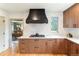 Modern kitchen features with a statement range hood at 2512 Premier Pl, Boulder, CO 80304
