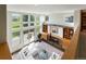 Spacious living room with high ceilings, fireplace, and large windows offering scenic views at 2512 Premier Pl, Boulder, CO 80304