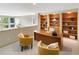 Home office with built-in shelving and hardwood desk at 2512 Premier Pl, Boulder, CO 80304