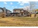 Sprawling backyard featuring a large lawn, patio with pergola and a house with neutral siding at 9407 Dolton Way, Highlands Ranch, CO 80126