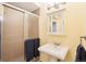 Small bathroom with shower, a pedestal sink, and neutral walls and a medicine cabinet at 9407 Dolton Way, Highlands Ranch, CO 80126