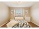 Cozy bedroom featuring neutral walls and a flower-themed comforter set at 9407 Dolton Way, Highlands Ranch, CO 80126