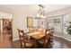 Dining room with modern light fixture and shuttered windows at 9407 Dolton Way, Highlands Ranch, CO 80126