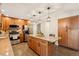 Spacious kitchen with stainless appliances, granite countertops, and wood cabinetry at 9407 Dolton Way, Highlands Ranch, CO 80126