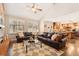 Inviting living room features a brick fireplace, hardwood floors, and vaulted ceilings at 9407 Dolton Way, Highlands Ranch, CO 80126