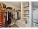 Organized walk-in closet with custom shelving, hanging racks, and storage solutions at 9407 Dolton Way, Highlands Ranch, CO 80126