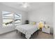 Bright bedroom with a ceiling fan, large windows, and neutral-toned decor for a relaxing atmosphere at 1457 S Pierce St, Lakewood, CO 80232