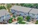 Aerial view of blue townhomes with well-maintained landscaping at 1457 S Pierce St, Lakewood, CO 80232