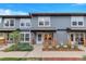 Charming home featuring a porch, manicured landscaping, and a well-maintained front yard at 1457 S Pierce St, Lakewood, CO 80232