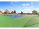 Community tennis courts featuring green and blue hard surface at 1457 S Pierce St, Lakewood, CO 80232