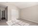 Well-lit bedroom with double-door closet and carpet flooring at 15907 E 13Th Ave, Aurora, CO 80011