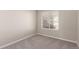 Spacious bedroom with carpeted floors and large window at 15907 E 13Th Ave, Aurora, CO 80011