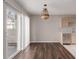 Bright dining area with hardwood floors, chandelier and sliding glass doors at 15907 E 13Th Ave, Aurora, CO 80011