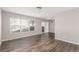 Spacious dining room with dark hardwood floors and sliding glass door at 15907 E 13Th Ave, Aurora, CO 80011