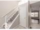 Bright entryway with staircase, storage closet, and view to living area at 15907 E 13Th Ave, Aurora, CO 80011