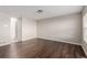 Simple living room with hardwood floors and neutral wall colors at 15907 E 13Th Ave, Aurora, CO 80011