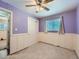 Bedroom with ceiling fan and purple walls at 1120 N Norfolk St, Aurora, CO 80011