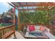 Stylish backyard patio with a pergola, comfortable seating, and fire pit, perfect for outdoor relaxation at 16553 Gilpin St, Thornton, CO 80602