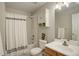 Cozy bathroom with shower and tub combo, a modern sink, and updated fixtures at 16553 Gilpin St, Thornton, CO 80602