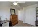 Versatile bedroom with ceiling fan, and built-in storage options at 16553 Gilpin St, Thornton, CO 80602