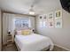 Comfortable bedroom with ample natural light, ceiling fan, and decorative wall art at 16553 Gilpin St, Thornton, CO 80602