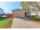 A beautiful home with a stone facade, two-car garage and lovely landscaping in a suburban neighborhood at 16553 Gilpin St, Thornton, CO 80602