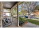 Relaxing covered front porch with comfortable seating, offering an inviting outdoor space to relax and enjoy the neighborhood at 16553 Gilpin St, Thornton, CO 80602