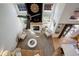 Bright, open living room with vaulted ceilings, fireplace, ceiling fan, and neutral decor at 16553 Gilpin St, Thornton, CO 80602