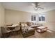 A large room features carpet, neutral color walls, and is well-lit from the large windows at 16553 Gilpin St, Thornton, CO 80602