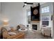 A cozy living room has a stone fireplace, carpeted floors, and plenty of natural light at 16553 Gilpin St, Thornton, CO 80602