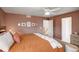 Warm main bedroom with plush bed, decor, and access to an ensuite bathroom at 16553 Gilpin St, Thornton, CO 80602