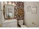 Stylish powder room with floral wallpaper, modern vanity, and elegant decor at 16553 Gilpin St, Thornton, CO 80602