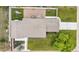 Aerial view of a property showcasing a spacious backyard, pergola-covered patio, and well-maintained landscaping at 7155 E Exposition Ave, Denver, CO 80224