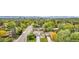 Scenic aerial view showcasing a neighborhood with tree-lined streets, well-maintained homes, and vibrant greenery at 7155 E Exposition Ave, Denver, CO 80224