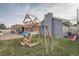 Backyard featuring playset and patio with pergola perfect for entertaining at 7155 E Exposition Ave, Denver, CO 80224
