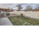 Backyard with patio, pergola, privacy fence and newly installed landscaping at 7155 E Exposition Ave, Denver, CO 80224