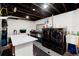 Finished basement laundry room area with a washer and dryer and utility sink at 7155 E Exposition Ave, Denver, CO 80224