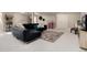 Finished basement featuring plush carpeting, a leather couch, and ample space for entertaining at 7155 E Exposition Ave, Denver, CO 80224