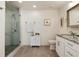 Elegant bathroom showcasing a glass shower, granite countertops, and modern fixtures at 7155 E Exposition Ave, Denver, CO 80224