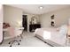 Bedroom features neutral walls, carpet, a walk-in closet, and a desk for studying or working at 7155 E Exposition Ave, Denver, CO 80224