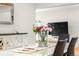 Bright dining room features a modern table and chairs, perfect for Gathering meals at 7155 E Exposition Ave, Denver, CO 80224