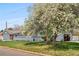 Charming single-story home featuring a well-maintained lawn and a freshly painted gray exterior at 7155 E Exposition Ave, Denver, CO 80224