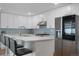 Modern kitchen featuring stainless steel appliances, sleek countertops, and ample cabinet space at 7155 E Exposition Ave, Denver, CO 80224