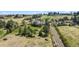 Aerial shot of a two-story house with well-manicured lawn in a treed neighborhood at 7388 S Ireland Cir, Centennial, CO 80016