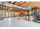 Spacious basement area with exposed utilities, ready for customization and recreation at 7388 S Ireland Cir, Centennial, CO 80016