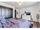 Bright bedroom with a large bed, dresser, and modern decor at 7388 S Ireland Cir, Centennial, CO 80016